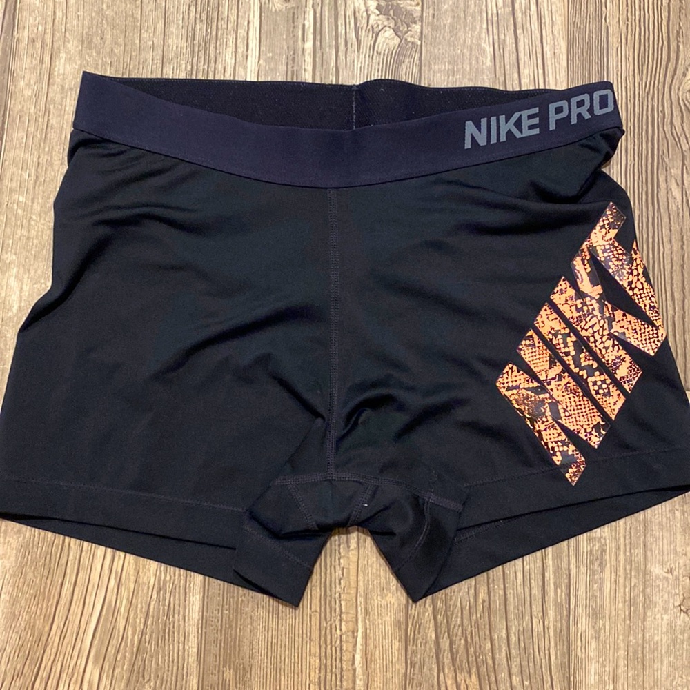 Nike pro, dri-fit shorts, black with neon coral design. Size XL.